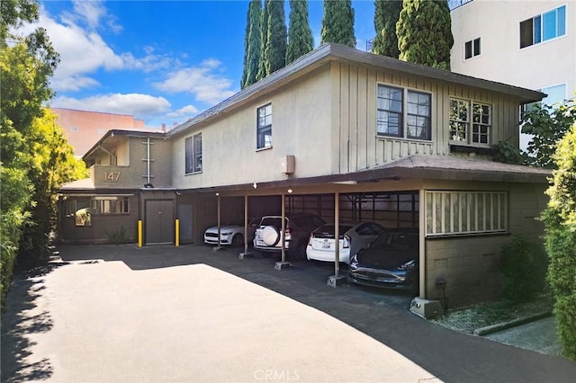 rear view of house with a carport