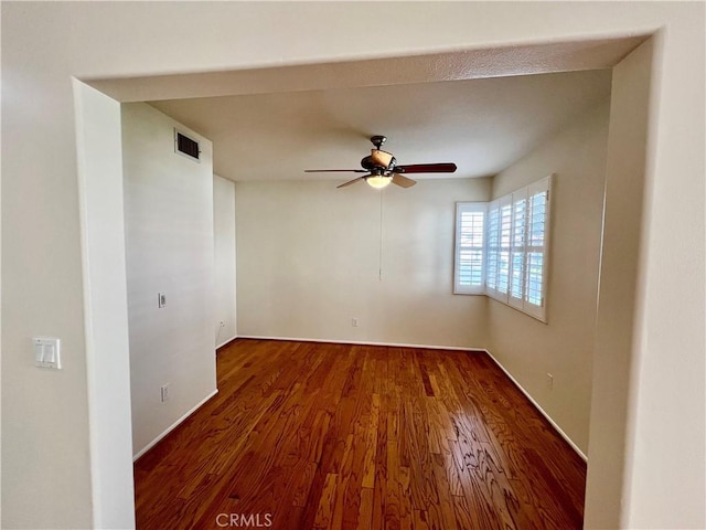 empty room featuring ceiling fan and hardwood / wood-style floors