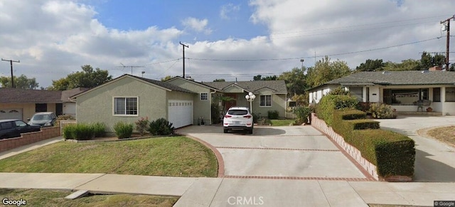 single story home with a garage and a front yard