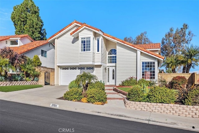 view of front of house with driveway and a garage