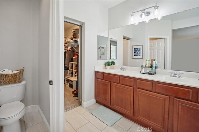31242 Bell Mountain Rd, Menifee, CA 92584 - full bath with toilet, double vanity, tile patterned floors, a spacious closet, and baseboards