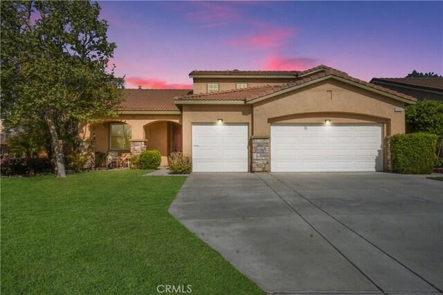 31242 Bell Mountain Rd, Menifee, CA 92584 - mediterranean / spanish home featuring stucco siding, driveway, a garage, a front lawn, and a tile roof