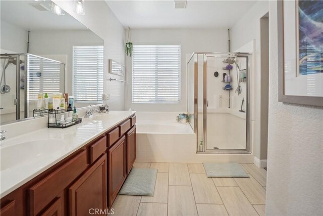 31242 Bell Mountain Rd, Menifee, CA 92584 - bathroom featuring a stall shower, a garden tub, and double vanity