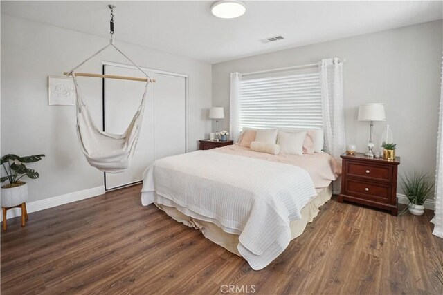 31242 Bell Mountain Rd, Menifee, CA 92584 - bedroom featuring wood finished floors, baseboards, and a closet