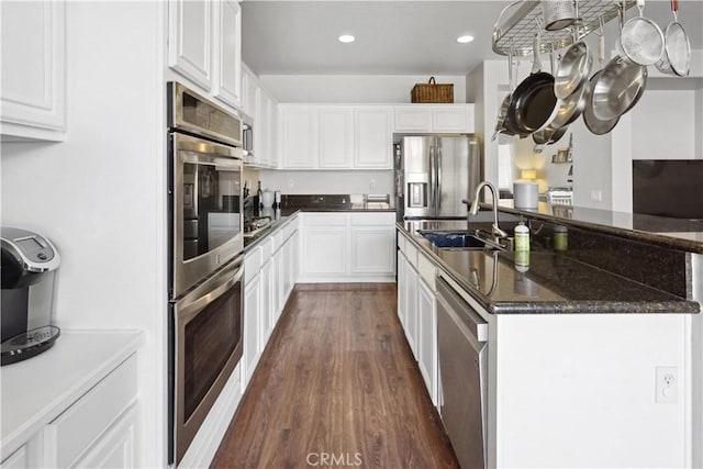 31242 Bell Mountain Rd, Menifee, CA 92584 - kitchen featuring a sink, stainless steel appliances, dark wood finished floors, white cabinetry, and recessed lighting