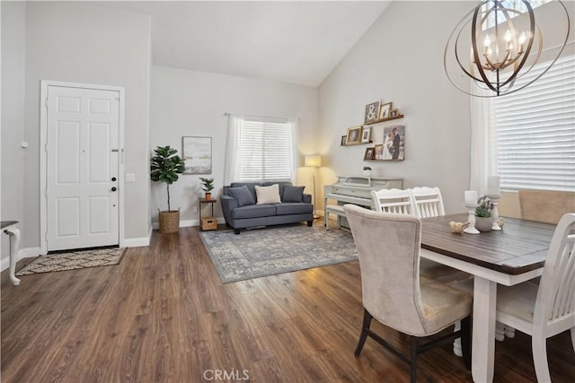 31242 Bell Mountain Rd, Menifee, CA 92584 - dining area with wood finished floors, a chandelier, baseboards, and high vaulted ceiling