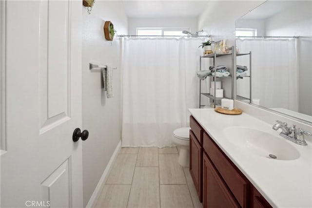 31242 Bell Mountain Rd, Menifee, CA 92584 - full bathroom featuring toilet, vanity, baseboards, and shower / bath combo