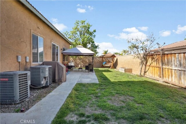 31242 Bell Mountain Rd, Menifee, CA 92584 - view of yard featuring central AC unit, a gazebo, and a patio area