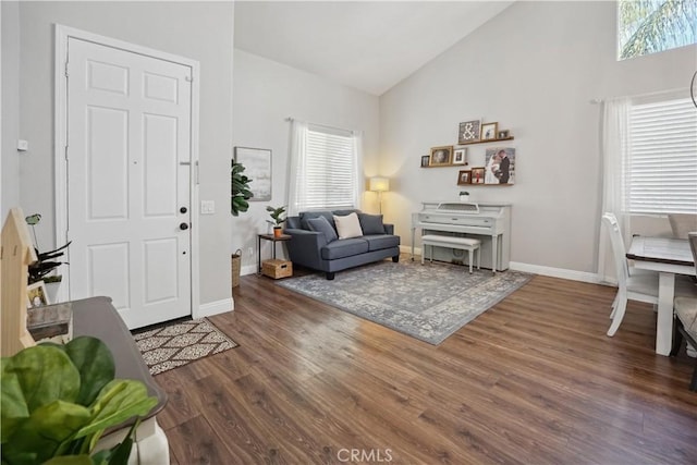 31242 Bell Mountain Rd, Menifee, CA 92584 - living area featuring healthy amount of natural light, wood finished floors, high vaulted ceiling, and baseboards