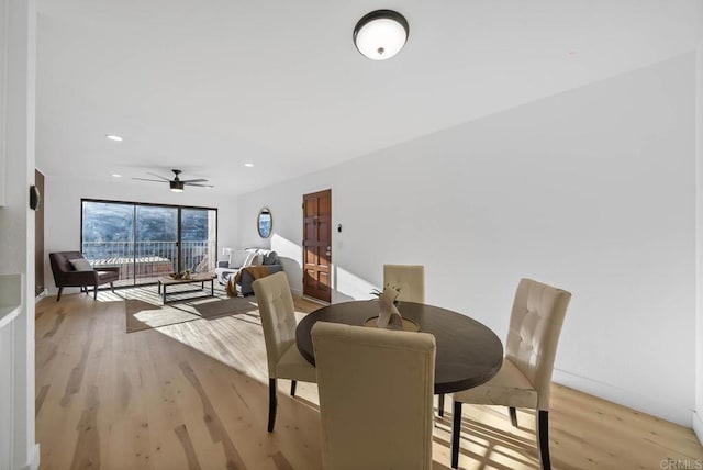 dining area featuring ceiling fan and light hardwood / wood-style flooring