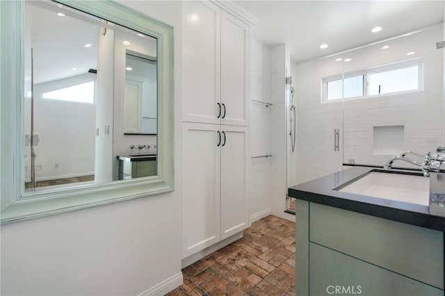 bathroom featuring vanity and walk in shower