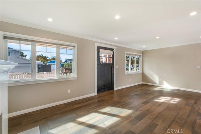 foyer entrance featuring dark hardwood / wood-style flooring and ornamental molding