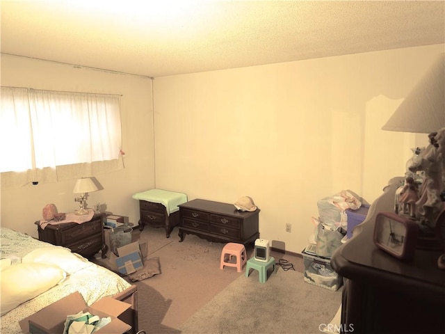 carpeted bedroom with a textured ceiling