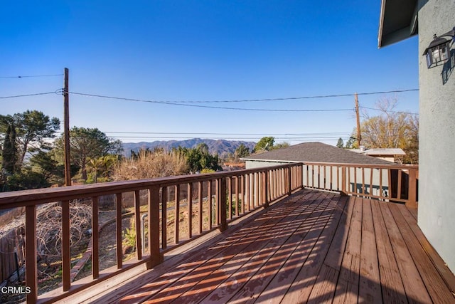 wooden deck with a mountain view