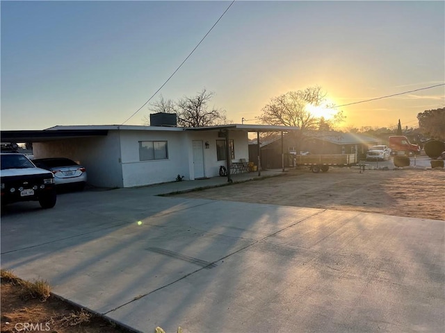 view of front of home featuring a carport