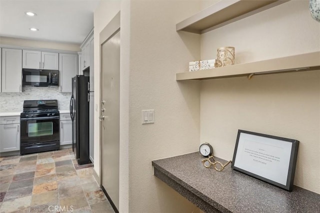 kitchen with backsplash, gray cabinets, and black appliances