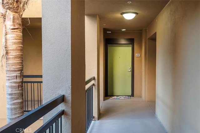 hallway featuring concrete flooring