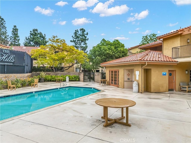 view of swimming pool with a patio area