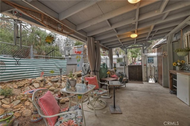 view of patio featuring fence