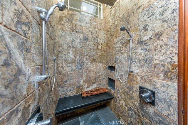 bathroom featuring a tile shower