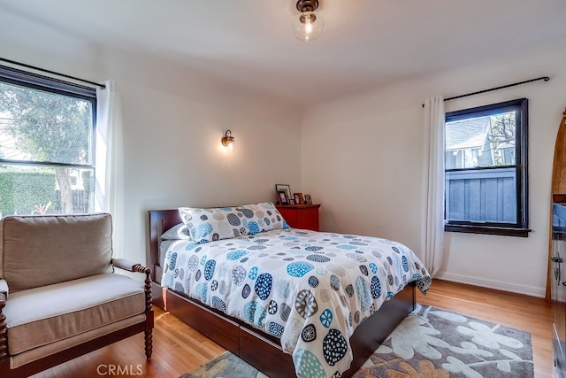 bedroom with wood-type flooring