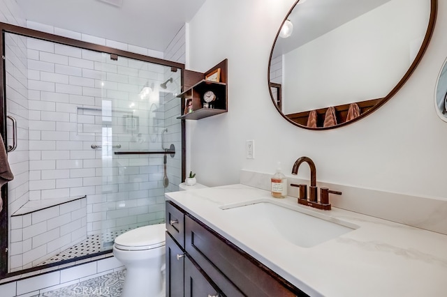 bathroom featuring vanity, an enclosed shower, tile patterned floors, and toilet