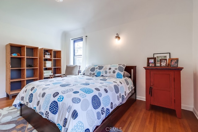 bedroom with wood-type flooring