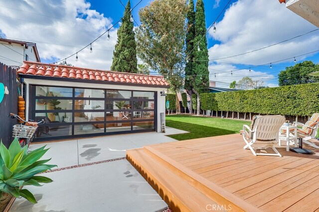 wooden deck featuring a yard