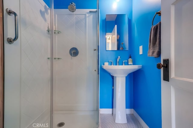 bathroom featuring tile patterned floors and an enclosed shower