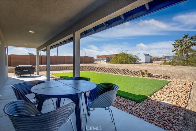 view of patio featuring a grill