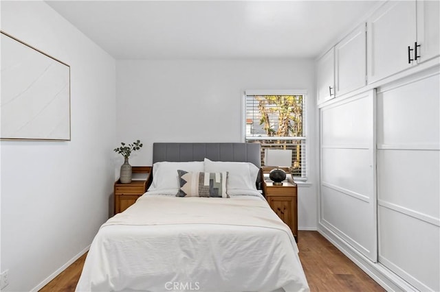 bedroom featuring hardwood / wood-style floors