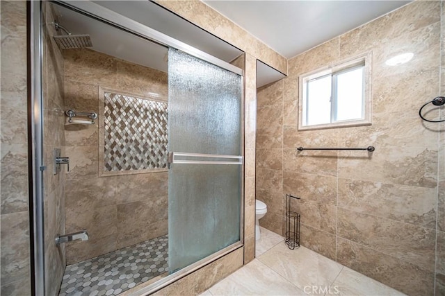 bathroom with toilet and walk in shower