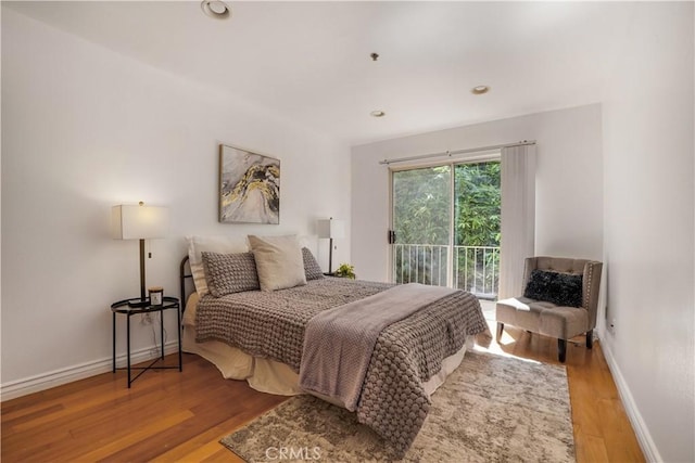 bedroom featuring access to outside and light wood-type flooring