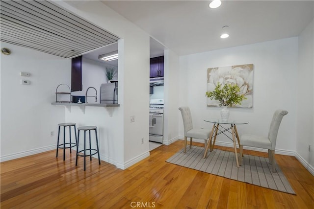 dining space featuring light wood-type flooring