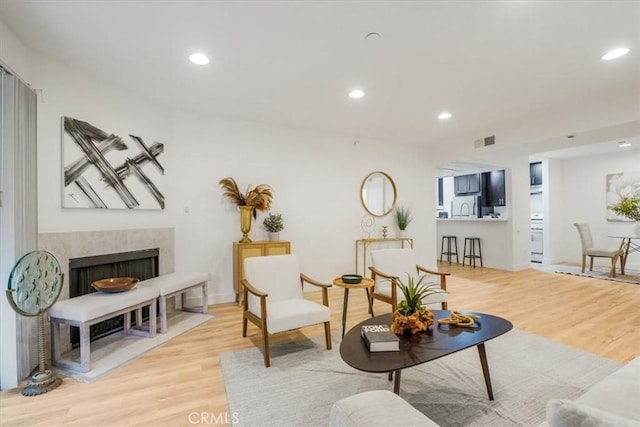 living area with light hardwood / wood-style floors