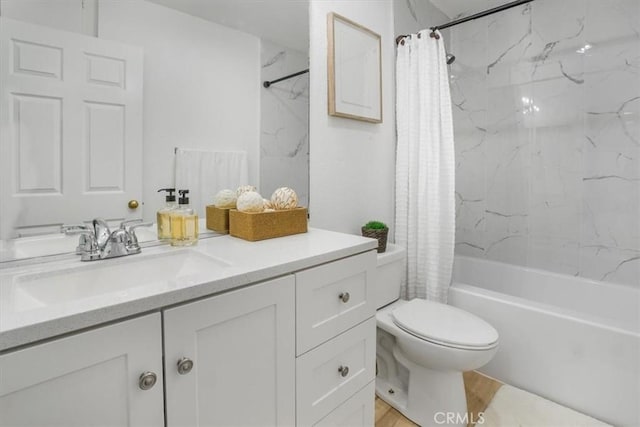 full bathroom with vanity, toilet, and shower / tub combo