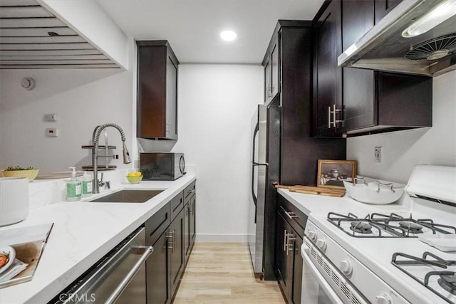 kitchen with sink, ventilation hood, stainless steel dishwasher, white gas stove, and light wood-type flooring