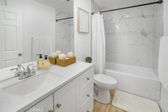 full bathroom featuring vanity, wood-type flooring, toilet, and shower / bath combo with shower curtain