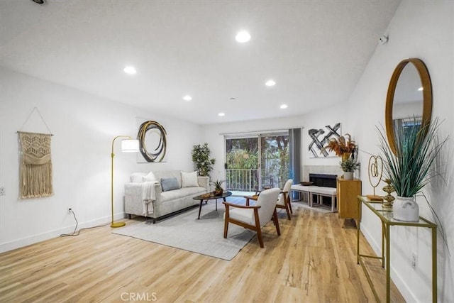 living room with light hardwood / wood-style flooring