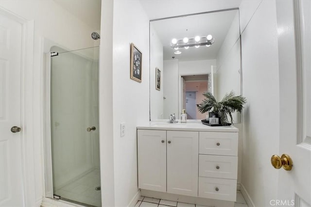 bathroom featuring vanity and a shower with shower door