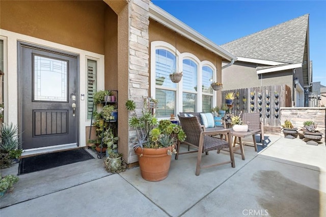 entrance to property with a patio area