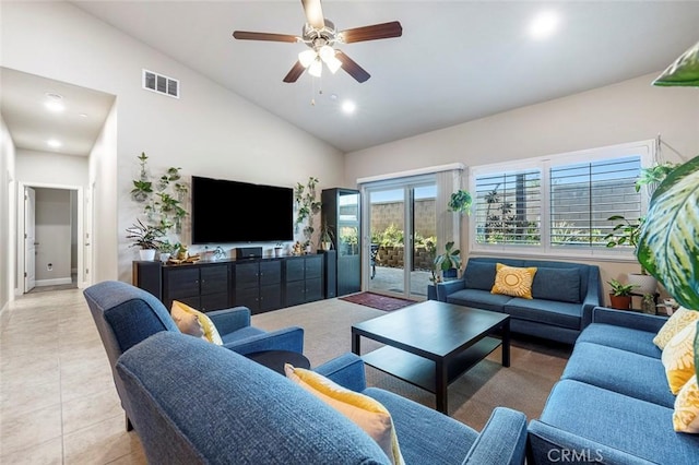 tiled living room featuring high vaulted ceiling and ceiling fan