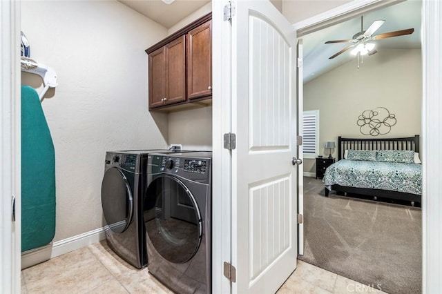 washroom with washer and dryer, light carpet, cabinets, and ceiling fan