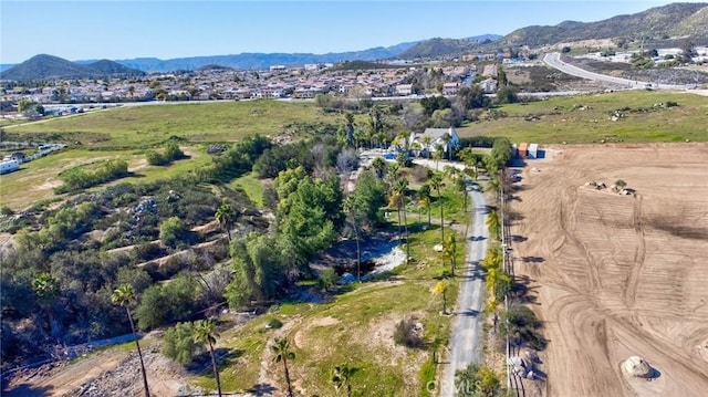 drone / aerial view featuring a mountain view