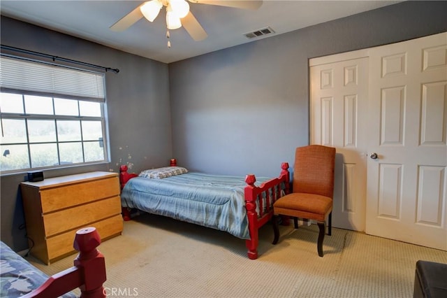 carpeted bedroom featuring ceiling fan