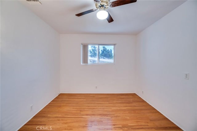 spare room featuring ceiling fan and light hardwood / wood-style floors