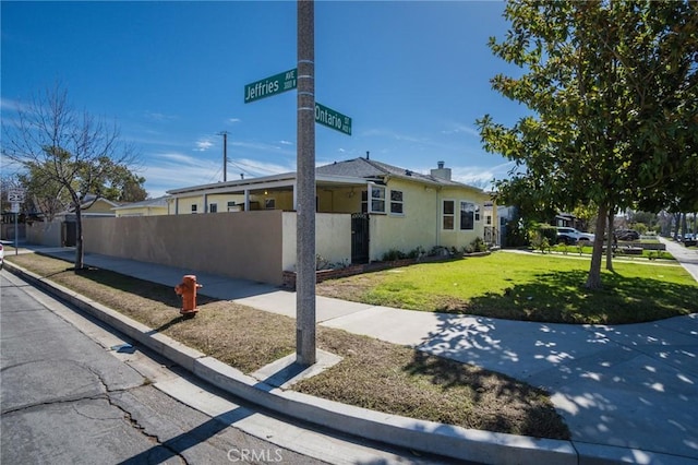 view of home's exterior with a yard