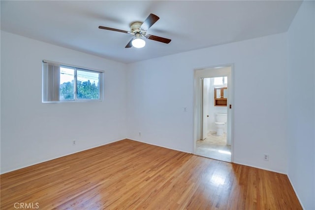 unfurnished room featuring ceiling fan and light hardwood / wood-style floors