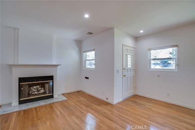 unfurnished living room featuring light hardwood / wood-style flooring