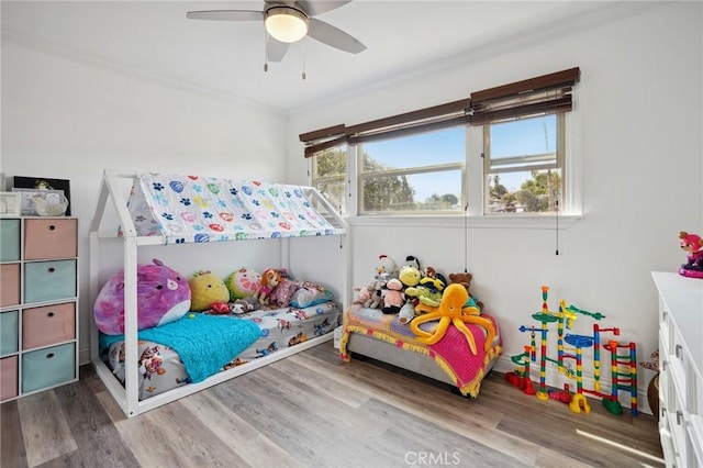 bedroom with hardwood / wood-style flooring and ceiling fan